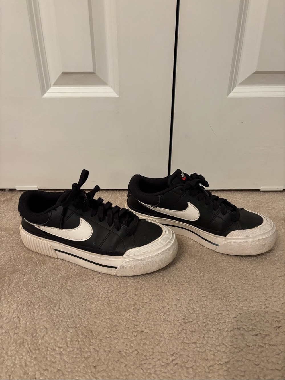 Nike Black Sneakers with White Swoosh